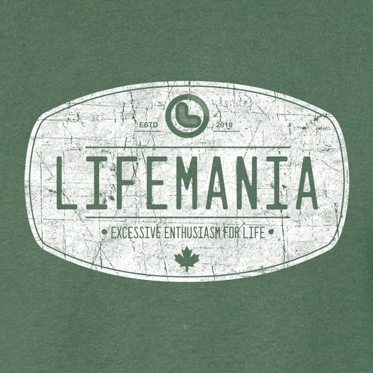 A green crew neck t-shirt with the distressed oval 'LIFEMANIA' logo printed on the front.