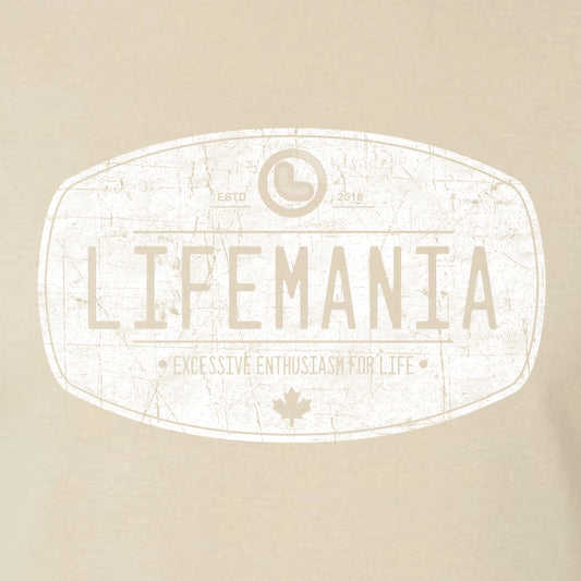 A beige t-shirt with the white distressed oval 'Lifemania' logo on the front.