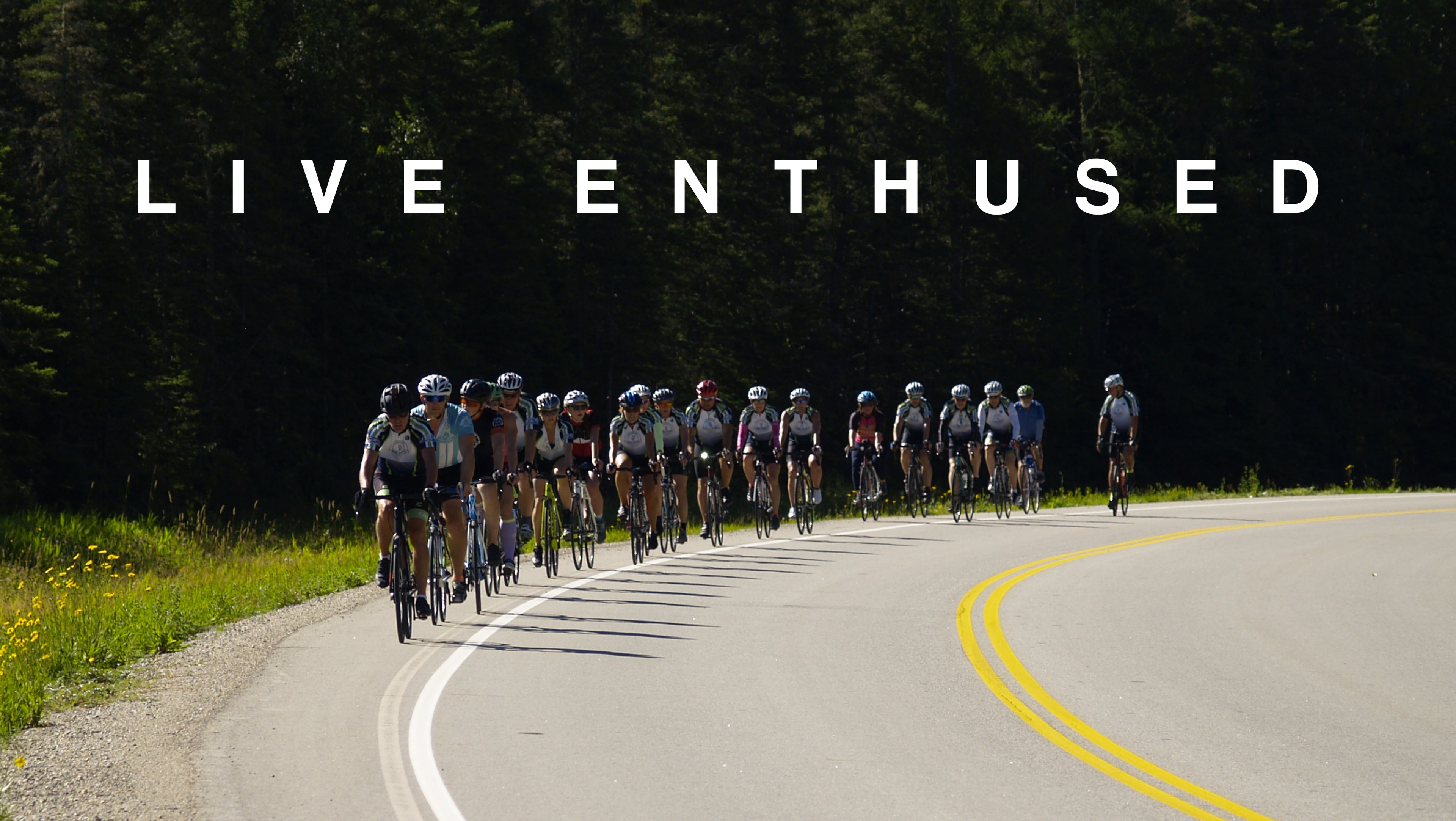 Group of cyclists on a road with 'Live Enthused' text overlay